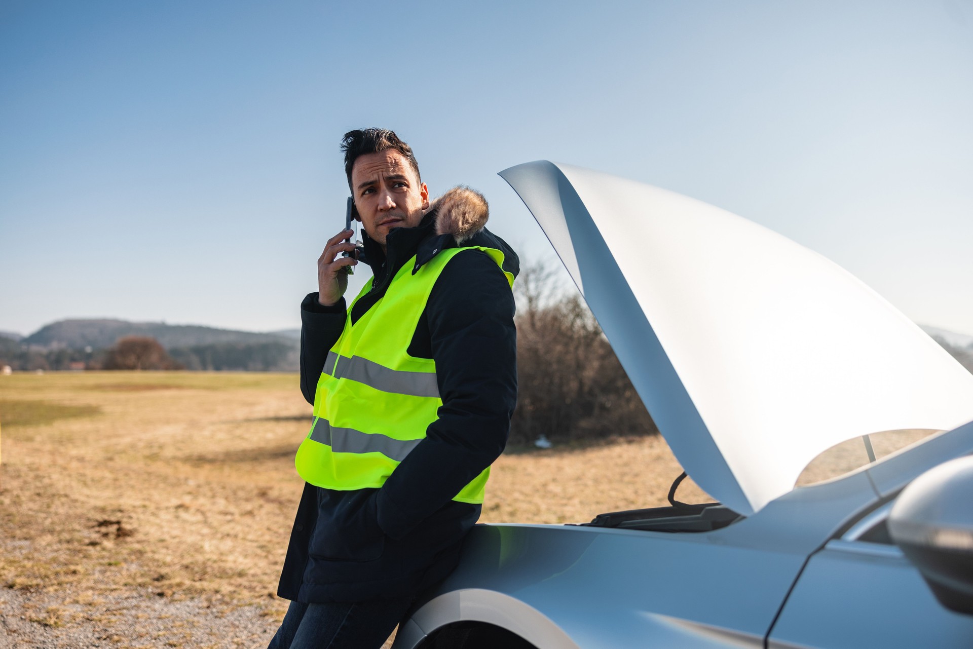 Man Calling For Car Assistance On The Side Of The Road